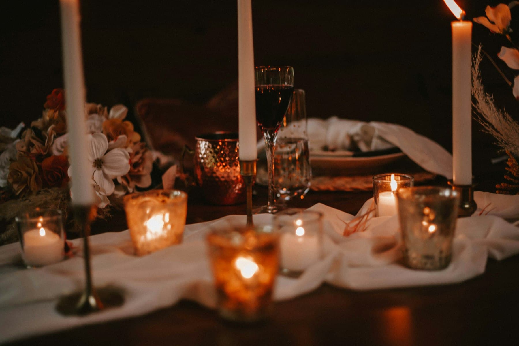 A candlelit wedding reception at night